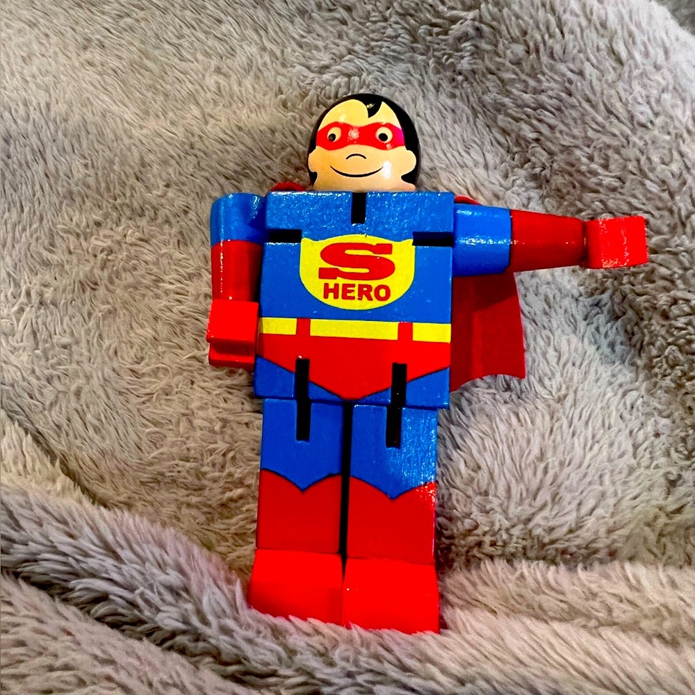 Posable, wooden superhero toy